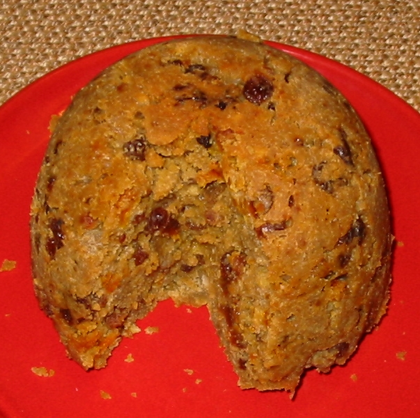 a Christmas pudding against a red background